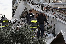 Search and rescue team from Romania working on a collapsed building