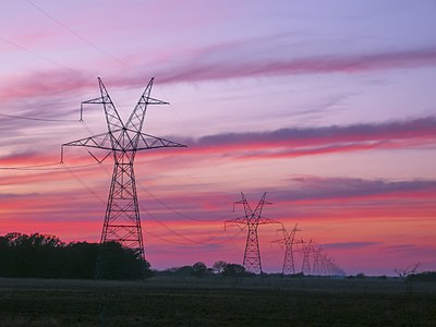 Transmission towers and lines at sunset in East Texas