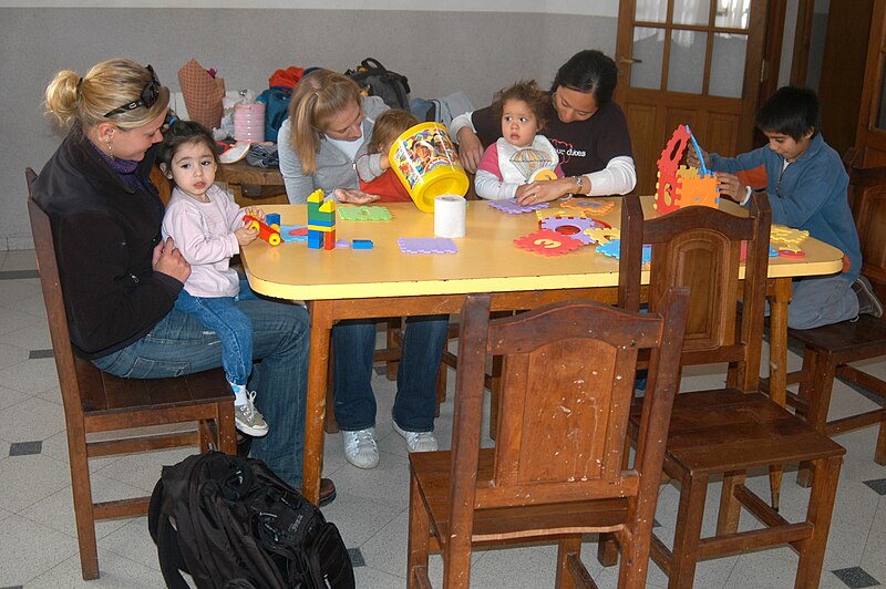 File:US Navy 070512-N-8629D-128 Ensign Laura Dogger, USS Mitscher (DDG 57), Ensign Kathryn Gelenter, USS Pearl Harbor (LSD 52) and Ensign Jenny Phillips, Pearl Harbor, play with children at Casa Del Niño (Home for Children).jpg