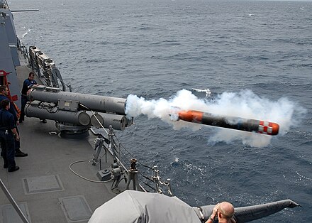 USS Mustin launches a dummy torpedo during exercises.