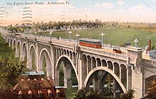 A 1920 postcard of a Lehigh Valley Transit's Liberty Bell Trolley crossing the present-day Albertus L. Meyers Bridge in Allentown in 1920 1920 - 8th Street Bridge with LVT Liberty Bell Trolley.jpg