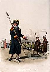 A beadle, carrying his staff; behind him two churchwardens (coloured aquatint, 1805). A beadle, carrying his staff; behind him two churchwardens l Wellcome V0013366.jpg