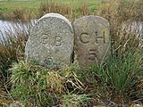 Two stones. One of 60 supplied by Robert Burchell to the Corporation of Hastings (CH), made with York stone (1859). The other marking the Bexhill Borough (BB) with 63 stones (1902).