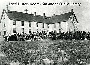 Students and staff in front of the Battleford Industrial School in 1889 Battleford Industrial School in 1889 ph-2001-64.jpg