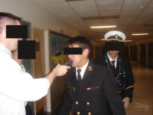 A midshipman is subjected to a random breathalyzer test to determine sobriety. Breathalyzer test 0013.png