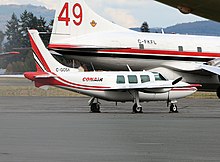 Piper Aerostar "bird dog" parked beside a Convair 580 air tanker C-GOSX (21105222833).jpg