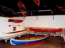 An exhibit hall in the Wisconsin Canoe Heritage Museum. Two canoes built by J. H. Rushton, Canton, New York, are along the left wall, and the red canoe was built by B. N. Morris, Veazie, Maine. Canoe-museum.jpg