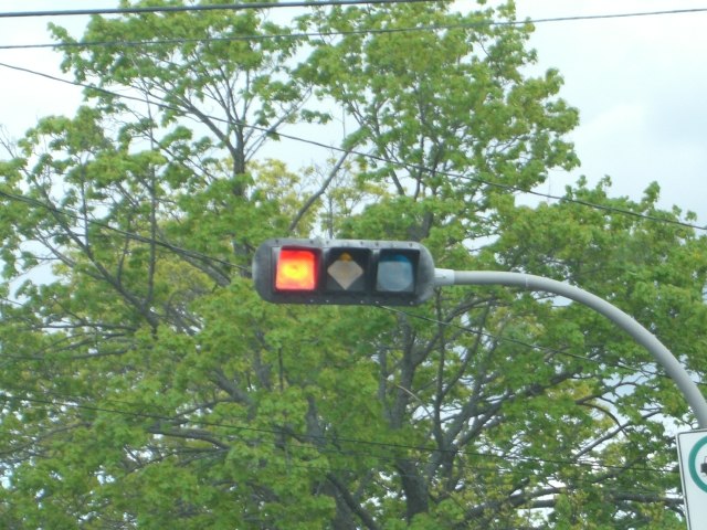 A traffic signal in Halifax, Nova Scotia, with specially shaped lights to assist people with colour blindness