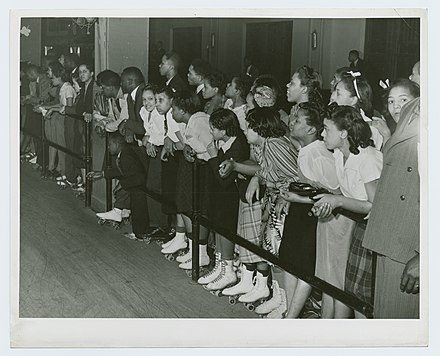 A crowd of roller skaters watch an exhibition in Chicago in 1939.