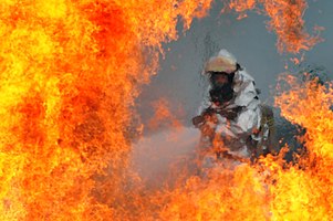 55 votes in Final (Statistics); Category in R1: People A U.S. Air Force firefighter sprays water at the fire of a simulated C-130 Hercules plane crash during operational readiness exercise Beverly. Credit:Template:POTY/credit/Defense.gov News Photo 120723-F-HA794-089 - A U.S. Air Force firefighter sprays water at the fire of a simulated C-130 Hercules plane crash during operational readiness exercise Beverly.jpg