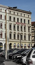 Residential and commercial building in closed development, corner house to Grünen Graben