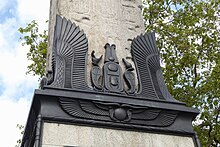 Egyptian-style additions at the base of the obelisk