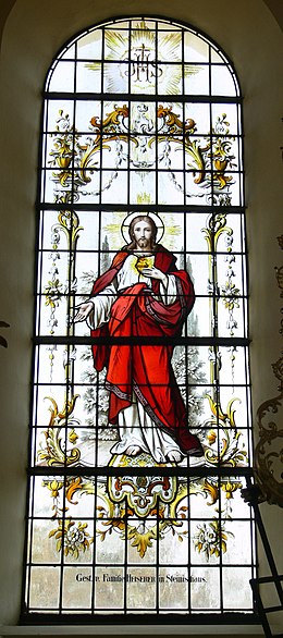 Stained-glass window with the Sacred Heart of Jesus in a parish church in Southern Germany
