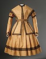 1869. Young girl's silk dress with matching pelerine and removable sleeves