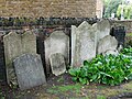 Gravestones along the churchyard wall around the Church of Saint George in Gravesend.