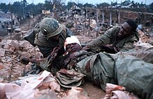 Two Marines help severely wounded Marine. HUE 1968 - Tet Offensive.jpg