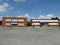 The Hellenic Cultural Center and Hellenic American Academy, located at 41 Broadway Street, Lowell, Massachusetts. Southeast (front) sides shown. Lowell City Hall is visible in the background at left.