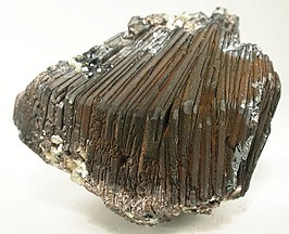 A cluster of parallel-growth, mirror-bright, metallic-gray hematite blades from Brazil