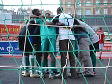 Players huddle during the Homeless World Cup 2007 in Copenhagen Homeless World Cup 2007 Copenhagen players.jpg
