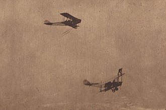 On 1 June 1919, Ormer Locklear waited on one biplane for a second one trailing a rope ladder. In Atlantic City Ormer Locklear of Locklear's Flying Circus clings to one plane waiting for a 2nd plane trailing a rope ladder.jpg