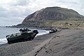 Amphibious Assault Vehicles (AAVs) line the beach below Mount Suribachi on the island of Iwo Jima in a static display for the 58th Anniversary of the Battle of Iwo Jima Commemoration
