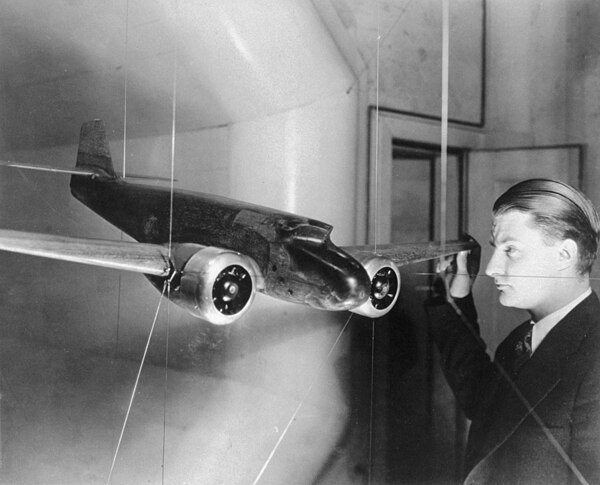 Clarence "Kelly" Johnson is testing an Electra model with single vertical tail and forward-sloping windshield in the University of Michigan's wind tun