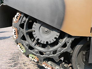 A sprocket wheel on a tank