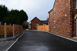 A photograph of the titular close of the 'Malet Close' development on the corner of James Reckitt Avenue and Clifford Street in Kingston upon Hull.