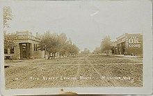 Main Street of Milligan, Nebraska is seen in this postcard mailed in 1912 Milligan NE 1912.jpg