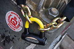 Kryptonite bicycle padlock and chain in a post. New York City 2005