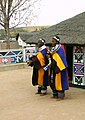 Ndebele Village Woman blowing in a horn.jpg