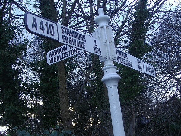 Old road signage at the A409/A410 roundabout