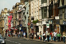 View along south side of the High Street from the Carfax end. Oxford High Street shoppers.jpg