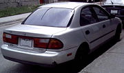 1997–1998 Mazda Protegé sedan (Canada) with 1997 Mazda's logo
