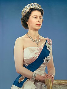 The financial success of Royal Journey, depicting Princess Elizabeth and Prince Philip's tour of Canada, aided the NFB and was one of the reasons that John Grierson said that William Arthur Irwin "saved the Film Board". Queen Elizabeth II official portrait for 1959 tour (retouched) (cropped) (3-to-4 aspect ratio).jpg