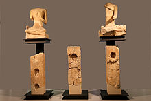 Sculpture from Roquepertuse, including "skull-niches" and seated figures Roquepertuse-Guerriers.jpg