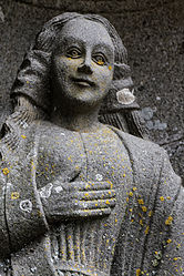 Statue of the Virgin Mary outside the south porch of the church of Notre- Dame at Saint-Thégonnec