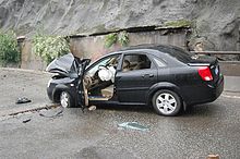 Car smashed by landslide rock, 2008 Sichuan earthquake Smashed Car in Dujiangyan - 2008 Sichuan earthquake (1).jpg