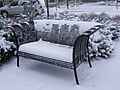 Snow-covered bench at Renaissance Suites at Flatiron