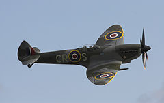 Supermarine Spitfire with 20 mm cannon protruding from the leading edge of the wing