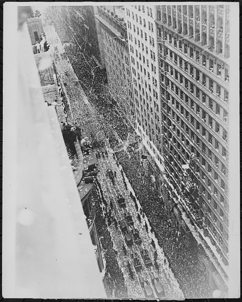 File:Ticker tape and confetti floating onto the motorcade carrying the crew of the Bremen, and the crowds assembled to greet - NARA - 541910.jpg