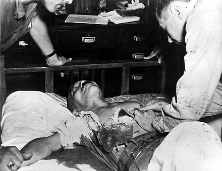 Japanese general Hideki Tojo, receiving treatment immediately after attempted suicide, 1945