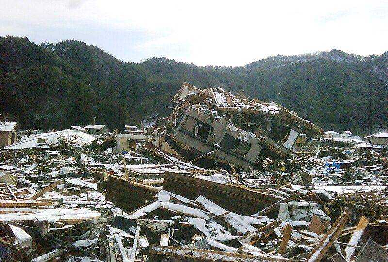 File:UKISAR in 2011 Japan earthquake 11 House turned upside-down by the force of tsunami.jpg