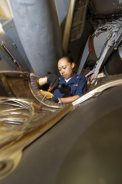 File:US Navy 040627-N-7748K-019 Aviation Machinist's Mate 3rd Class Irene Sotelo, from Waianae, Hawaii, removes rivets from an EA-6B Prowler engine bay wall.jpg