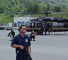 United States Marshals securing an immigration and customs prisoner transport. United States Marshals Service Special-production.jpg