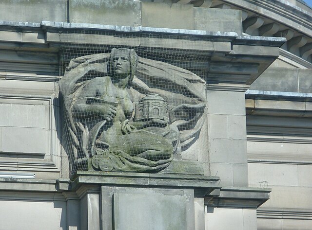 'Municipal Benificence'- one of the sculpted figures on the facade of the Hall