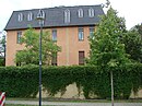 Villa Breysig with gardens and street-side fencing