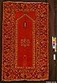 "Re-entrant" or "keyhole" prayer mat, also called a Bellini carpet, Anatolia, late 15th to early 16th century. The mat symbolically describes the environment of a mosque, with the entrance (the "keyhole"), and the mihrab (the forward corner) with its hanging mosque lamps. Metropolitan Museum of Art