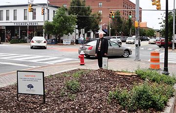 Toomer's Corner, at the intersection of College and Magnolia avenues in Auburn, Alabama, after the poisoned trees had been removed and the area placed under 24-hour surveillance 2013 Toomer's Corner trees removed.jpg