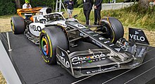 The Triple Crown livery used for the Monaco and Spanish Grands Prix, pictured on a display car 2023 McLaren MCL60.jpg